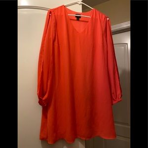 Petite Coral dress with slits in the sleeves.